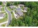 Aerial view of home with manicured lawns, tree coverage, and circular driveway, located in a suburban neighborhood at 4008 Pinot Way, Fort Mill, SC 29707