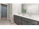 Modern bathroom featuring double sinks, a gray vanity, and a shower with a stylish geometric curtain at 4008 Pinot Way, Fort Mill, SC 29707
