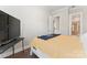 Comfortable bedroom with light grey walls, hardwood floors, and modern television at 4008 Pinot Way, Fort Mill, SC 29707