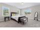 Bright bedroom with carpet, large windows, and a cozy seating area at 4008 Pinot Way, Fort Mill, SC 29707