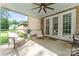 Covered patio with comfortable seating, a ceiling fan and views of the backyard and surrounding landscape at 4008 Pinot Way, Fort Mill, SC 29707