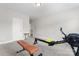 Bright and spacious exercise room features neutral carpet and a variety of workout equipment at 4008 Pinot Way, Fort Mill, SC 29707