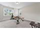Spacious exercise room with neutral carpet, and two windows with natural light overlooking the property at 4008 Pinot Way, Fort Mill, SC 29707