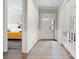 Bright hallway with wood floors, paneled walls, and view into a bedroom at 4008 Pinot Way, Fort Mill, SC 29707