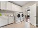 Well-equipped laundry room with front-load washer/dryer, ample cabinet space, and tile flooring at 4008 Pinot Way, Fort Mill, SC 29707