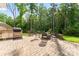 Paver patio with built-in BBQ, a fire pit and seating provides a perfect outdoor living space at 4008 Pinot Way, Fort Mill, SC 29707