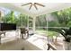 Relaxing screened porch with a ceiling fan and comfortable seating offering views of the backyard at 4008 Pinot Way, Fort Mill, SC 29707