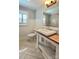 Charming bathroom featuring wainscoting, herringbone-patterned floors, and a unique vanity at 415 S Central Ave, Locust, NC 28097