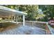 Expansive wooden deck perfect for outdoor entertaining with a beautiful view of the surrounding landscape at 415 S Central Ave, Locust, NC 28097