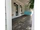 Inviting front porch with a cozy porch swing and stylish decor, creating a welcoming entrance at 415 S Central Ave, Locust, NC 28097