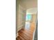 Charming hallway with built-in shelves leading to a brightly lit room with hardwood floors at 415 S Central Ave, Locust, NC 28097