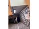 Compact kitchen corner with stainless steel microwave, set against a decorative tile backsplash at 415 S Central Ave, Locust, NC 28097