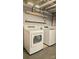 Laundry room featuring laundry machines and shelving at 415 S Central Ave, Locust, NC 28097