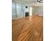 Spacious living room with hardwood floors, fireplace, built-in shelving, and neutral paint at 415 S Central Ave, Locust, NC 28097