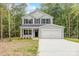 Charming two-story home with a two-car garage, black shutters, and a well-manicured front yard in a beautiful location at 4222 Acorn St, Charlotte, NC 28205