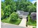 Aerial view of home showcases the meticulously landscaped yard, mature trees, and long driveway at 488 Saint George Rd, Fort Mill, SC 29708