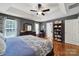 Spacious bedroom featuring a tray ceiling, gray walls, and dark wood furniture at 488 Saint George Rd, Fort Mill, SC 29708
