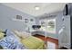 Light blue bedroom features wood floors, desk, twin bed, and a window at 488 Saint George Rd, Fort Mill, SC 29708