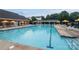 Community pool with ample lounge chairs and umbrellas provides a relaxing place to spend the day at 488 Saint George Rd, Fort Mill, SC 29708