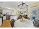 Comfortable dining area with modern chandelier, kitchen access, and ample seating at 488 Saint George Rd, Fort Mill, SC 29708