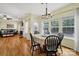 Inviting dining area open to living room, with ample natural light and hardwood flooring at 488 Saint George Rd, Fort Mill, SC 29708