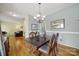 Charming dining room with hardwood floors, view into the living room, and classic furniture at 488 Saint George Rd, Fort Mill, SC 29708