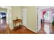 Hallway with wood floors and a classic wooden console table between bedrooms at 488 Saint George Rd, Fort Mill, SC 29708