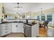 Spacious kitchen with white cabinets, black countertops, stainless steel appliances, and open layout at 488 Saint George Rd, Fort Mill, SC 29708