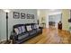 Inviting living room with hardwood floors, featuring stylish sofa, artwork, and decor at 488 Saint George Rd, Fort Mill, SC 29708