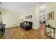 Bright living room with hardwood floors, comfortable seating, natural light, and fireplace at 488 Saint George Rd, Fort Mill, SC 29708