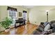 Cozy living area with hardwood floors, piano, guitar, comfortable seating, and ample natural light at 488 Saint George Rd, Fort Mill, SC 29708
