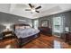 Spacious main bedroom with hardwood floors, tray ceiling, and natural light at 488 Saint George Rd, Fort Mill, SC 29708