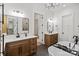 This spacious bathroom features two vanities, a soaking tub, a walk-in shower, and is adjacent to the walk-in closet at 5015 Lancaster Hwy, Monroe, NC 28112