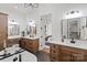 This bathroom has two vanities and a stand alone soaking tub with views into the main bedroom at 5015 Lancaster Hwy, Monroe, NC 28112