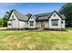 Close up of front entrance, showcasing the wooden doors and craftsman style columns at 5015 Lancaster Hwy, Monroe, NC 28112
