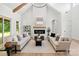 Cozy living room with a fireplace, bright natural light, and hardwood floors, perfect for relaxing and entertaining at 5015 Lancaster Hwy, Monroe, NC 28112
