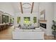 Bright and spacious living room featuring high ceilings, a modern fireplace, and large windows with backyard views at 5015 Lancaster Hwy, Monroe, NC 28112