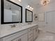 Elegant bathroom featuring double vanity with quartz countertop and modern fixtures at 5020 Forest Hills Pl, Fort Mill, SC 29707