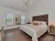 Bedroom featuring a vaulted ceiling and decorative headboard with stylish nightstand at 5020 Forest Hills Pl, Fort Mill, SC 29707