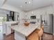 Bright kitchen with stainless steel appliances, quartz countertops and white cabinets at 5020 Forest Hills Pl, Fort Mill, SC 29707