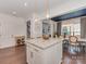 Stylish kitchen with island, quartz countertops, pendant lights, and view to dining area at 5020 Forest Hills Pl, Fort Mill, SC 29707