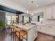 Open kitchen and dining area with stainless appliances, quartz countertops, a center island, and pendant lighting at 5020 Forest Hills Pl, Fort Mill, SC 29707