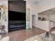Living room featuring a fireplace with a large screen television at 5020 Forest Hills Pl, Fort Mill, SC 29707