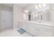 Bright bathroom featuring a double vanity with white cabinets, a large mirror, and a separate shower at 5098 Burnwald Ct, Fort Mill, SC 29715