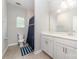 This bathroom has a single vanity with a framed mirror, a toilet, and a shower with a curtain at 5098 Burnwald Ct, Fort Mill, SC 29715