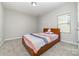 This cozy bedroom features a large window and soft carpet at 5098 Burnwald Ct, Fort Mill, SC 29715
