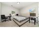 Well-lit bedroom featuring carpet, two windows, and a small foosball table at 5098 Burnwald Ct, Fort Mill, SC 29715