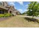 Charming home exterior with a well-manicured lawn, mature tree, and a neatly landscaped yard in a suburban neighborhood at 5098 Burnwald Ct, Fort Mill, SC 29715