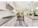 Well-equipped kitchen with white cabinetry, stainless steel appliances, and an open layout to the dining area at 5098 Burnwald Ct, Fort Mill, SC 29715