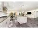 Bright, open kitchen with a large island, modern appliances, and seamless flow to the living area at 5098 Burnwald Ct, Fort Mill, SC 29715